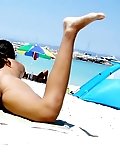Two skinny nudist teens frolic around the beach