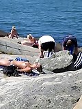 Hot teen blonde plays in the wet sand naked