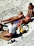 Hot teen blonde plays in the wet sand naked